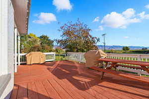 Front Deck with area for grilling and a mountain view