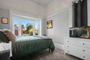 Carpeted bedroom with baseboards