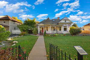 Victorian house with a porch and a chimney