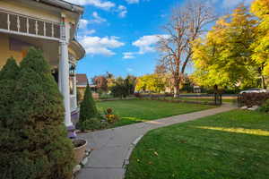 View of community featuring a lawn