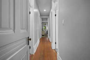Hall featuring light wood-style flooring and baseboards