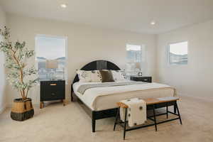 Bedroom with light carpet and recessed lighting