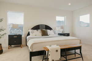 Bedroom featuring light carpet and recessed lighting