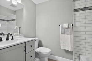 Bathroom featuring vanity and shower / bathtub combination