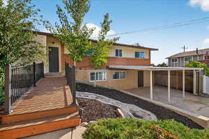 Rear view of property with brick siding