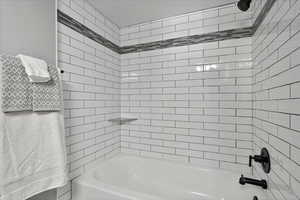 Full bathroom with shower / bath combination