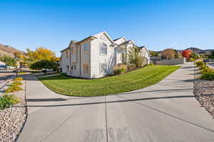 View of home's exterior with a mountain view, stucco siding, and a residential view