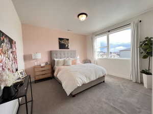 Bedroom with carpet flooring and baseboards