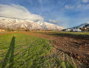 View of mountain backdrop with rural landscape