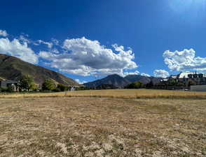 View of mountain backdrop with rural landscape