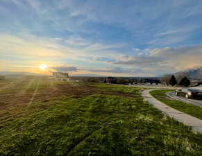 View of grassy yard featuring a mountain view