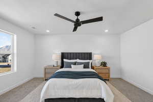 Bedroom featuring ceiling fan, carpet, and recessed lighting