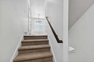 Staircase with a chandelier