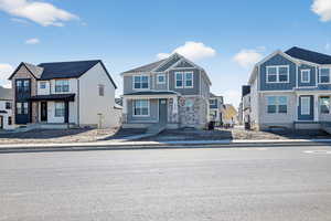 View of front facade with a residential view and board and batten siding