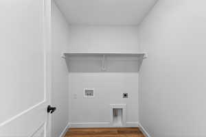 Washroom with dark wood finished floors, electric dryer hookup, and hookup for a washing machine