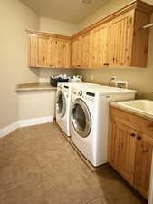 Washroom with cabinet space and separate washer and dryer