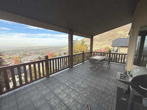 View of patio with outdoor dining area and area for grilling