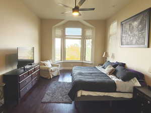 Bedroom with dark wood-style flooring and ceiling fan