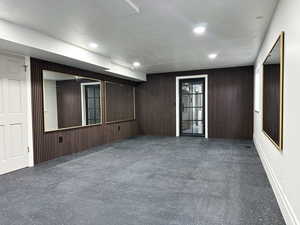 Large exercise room with glass door into the wellness room.
