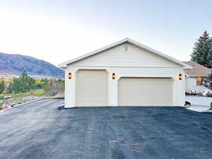 View of garage and extra parking space