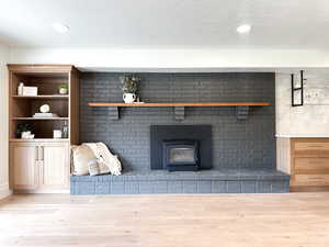 Family room featuring a fireplace and custom cabinetry