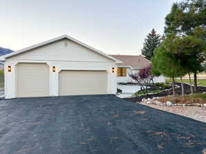 Ranch-style house with a garage, brick, and siding