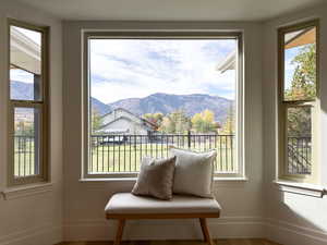 Entry into the flex space/den featuring a bay window and mountain views