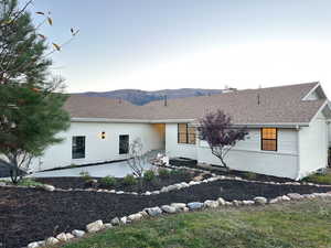 View of front facade and a mountain view