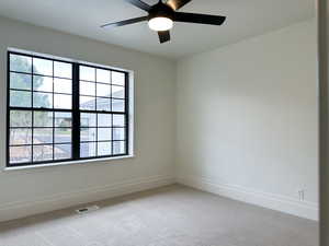 Bedroom with light carpet and ceiling fan