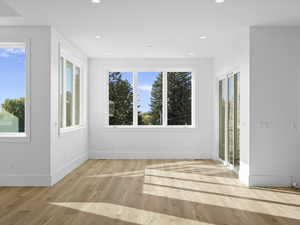 Dining knook with recessed lighting, healthy amount of natural light, and light wood-style floors