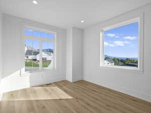 bedroom featuring light wood-type flooring and recessed lighting