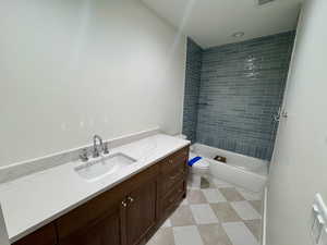 Full bathroom with vanity and washtub / shower combination