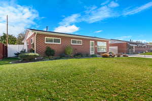 Ranch-style house with brick siding