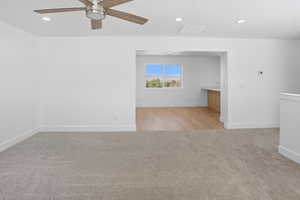 Unfurnished room featuring recessed lighting, light colored carpet, and ceiling fan