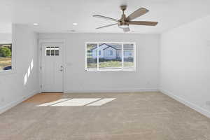 Entryway featuring light carpet, recessed lighting, and ceiling fan