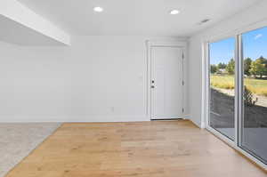 Spare room with recessed lighting and light wood-style flooring