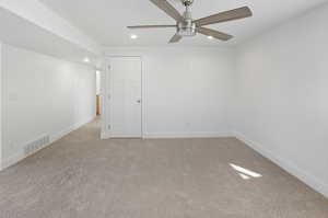 Spare room with light colored carpet, recessed lighting, and ceiling fan