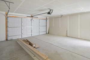 Garage featuring a garage door opener