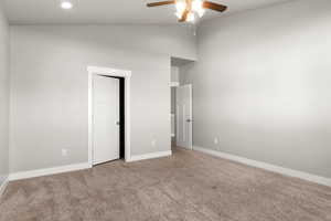 Unfurnished bedroom featuring carpet flooring, a ceiling fan, a closet, recessed lighting, and high vaulted ceiling