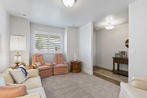 Living area featuring baseboards and wood finished floors