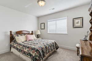 Bedroom with carpet and baseboards
