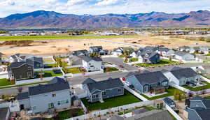 Aerial perspective of suburban area with a mountainous background