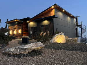 View of side of property with stairway