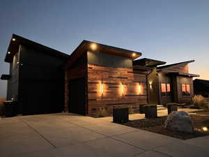 Contemporary home featuring a garage and driveway