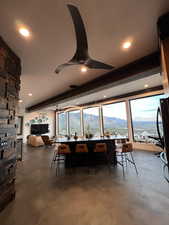 Dining room featuring finished concrete flooring, ceiling fan, recessed lighting, and healthy amount of natural light