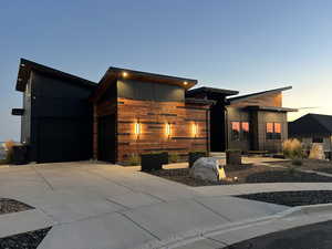 Modern home featuring driveway and a garage