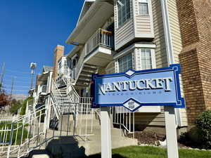 Community sign featuring a balcony