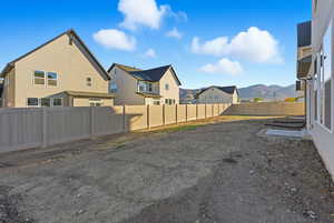 Fenced backyard with a residential view