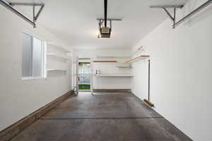 Garage featuring a garage door opener