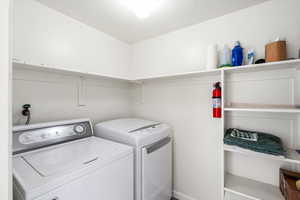 Laundry room featuring washer and dryer